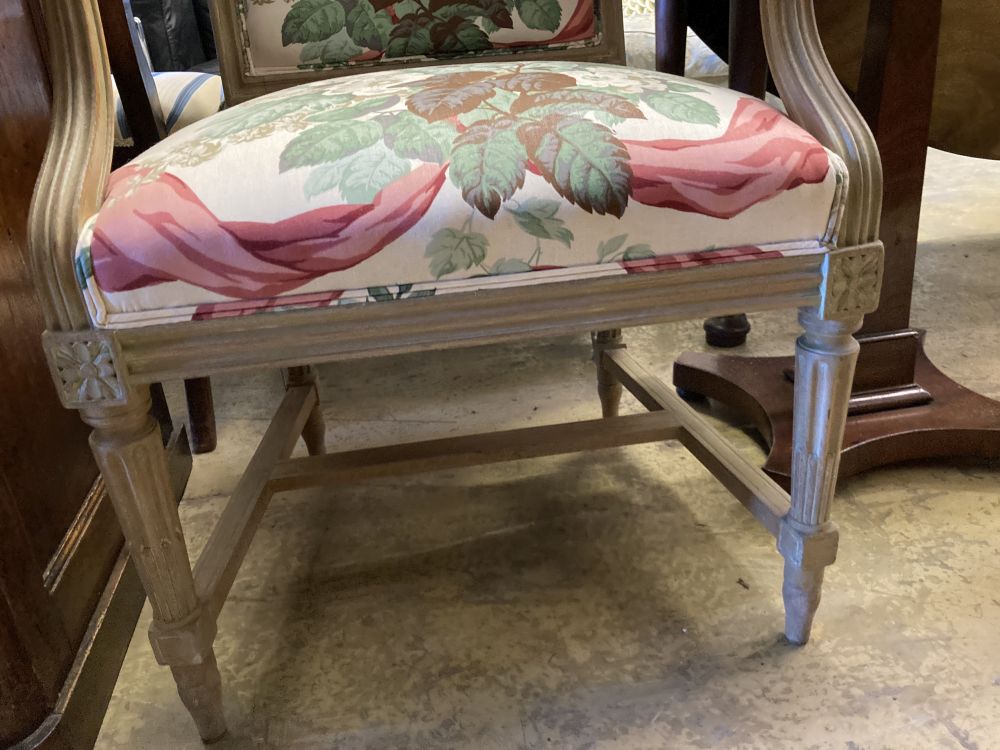 Two Louis XVI style cream painted carved wood fauteuils